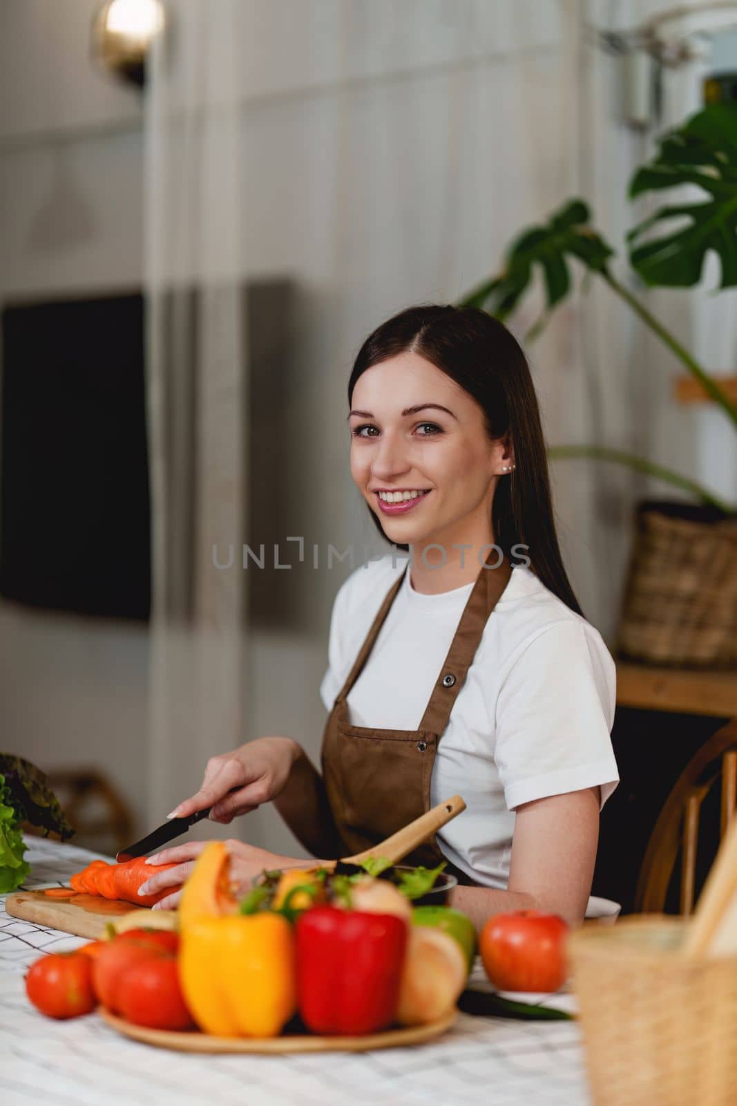 Young Healthy woman cooking healthy food in the kitchen at home. Healthy lifestyle, food, diet concept