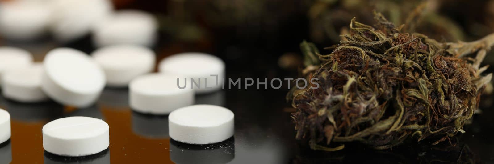 Marijuana buds and white pills, rest with cbd. Home relaxation soft drugs pastime therapy and alternative medicine