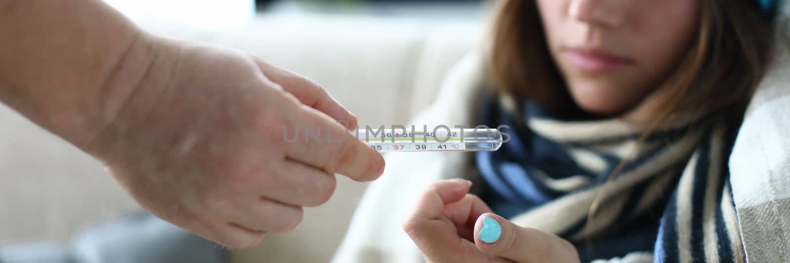 Sick woman person passes a thermometer closeup by kuprevich