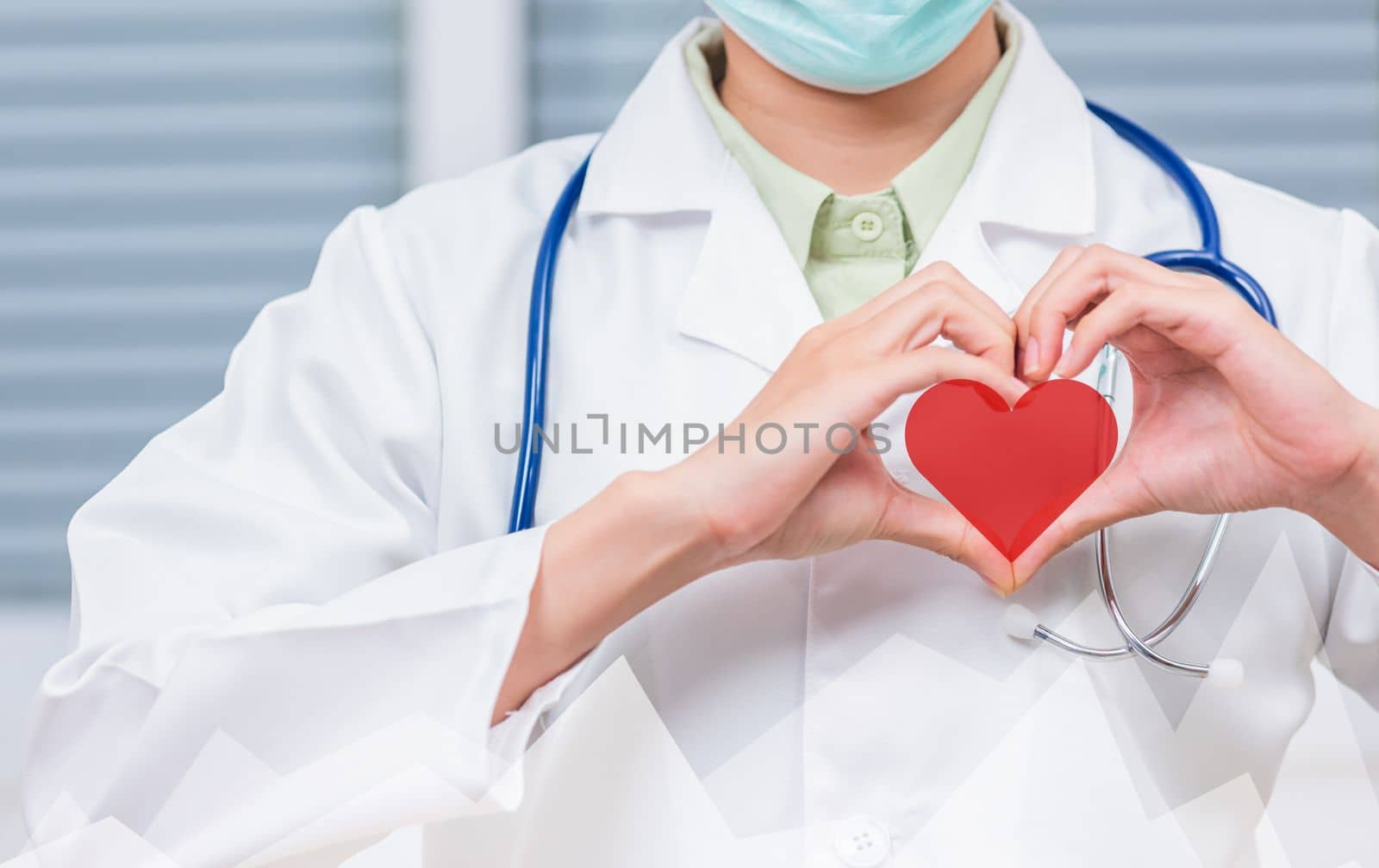 Doctor Day Concept. Doctor woman wearing uniform and stethoscope she making heart finger shape, Doctor's hand sign, Healthy medical heart, treatment of heart diseases by palms