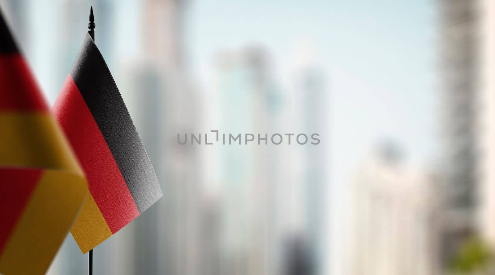 A small Germany flag on an abstract blurry background.