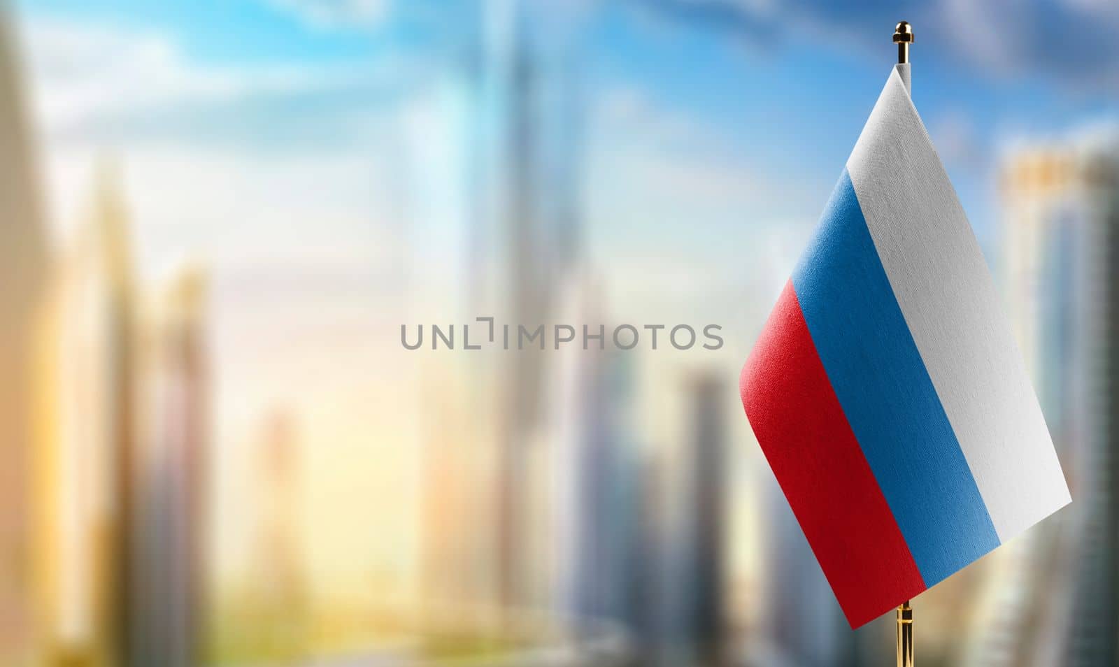 Small flags of the Russia on an abstract blurry background by butenkow