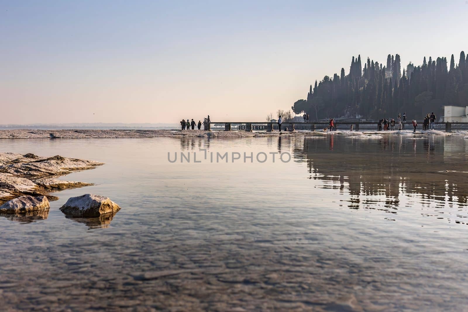 Spectacular landscape of rocky beach in Sirmione overlooking Lake Garda by pippocarlot