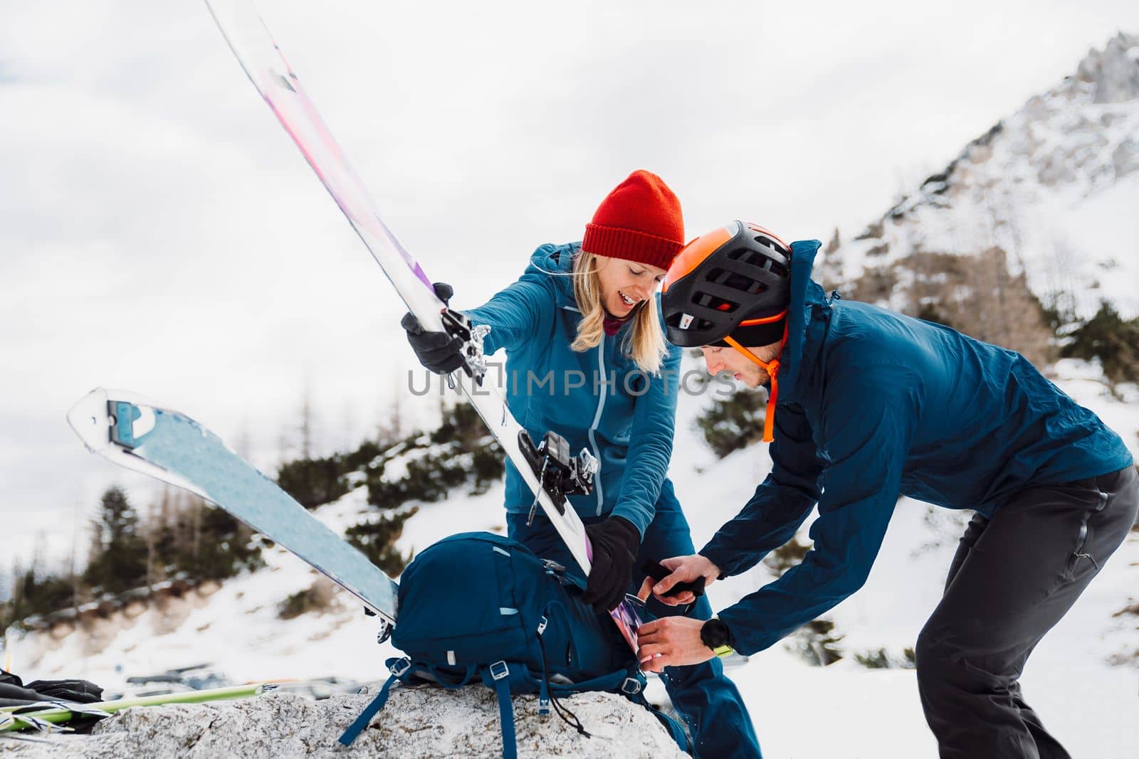 Couple getting ready for ski touring adventure in the Alps by VisualProductions