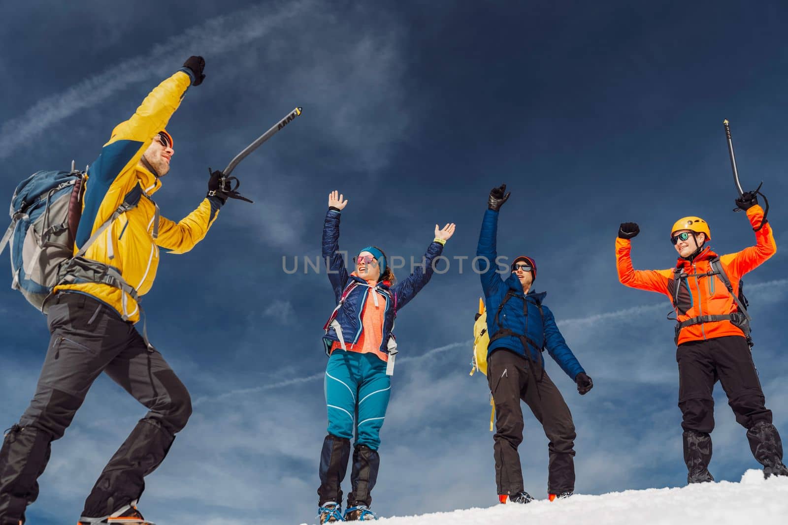 Mountaineer backcountry ski touring in the mountains. Ski touring in high alpine landscape with snowy trees. Adventure winter extreme sport. High quality photo