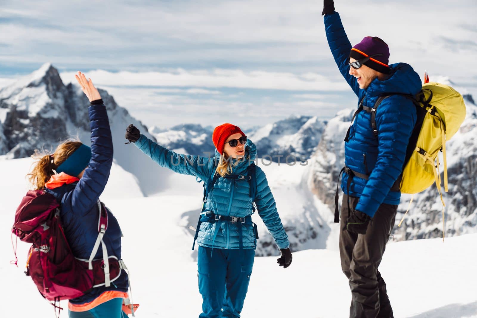 Group of smiling hikers happy to have reached the top - Winter Alps by VisualProductions