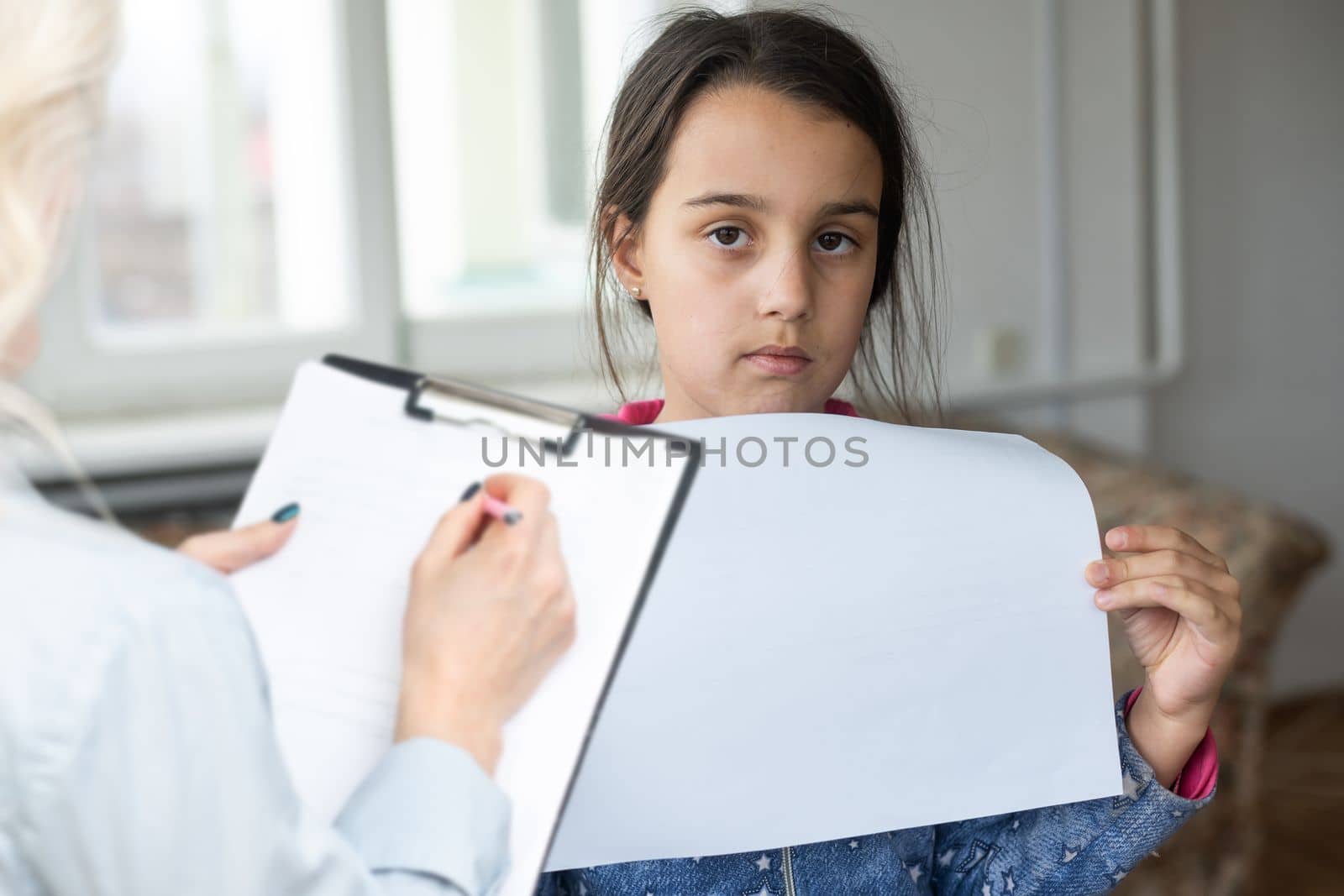 Cute little girl at child psychologist's office. by Andelov13