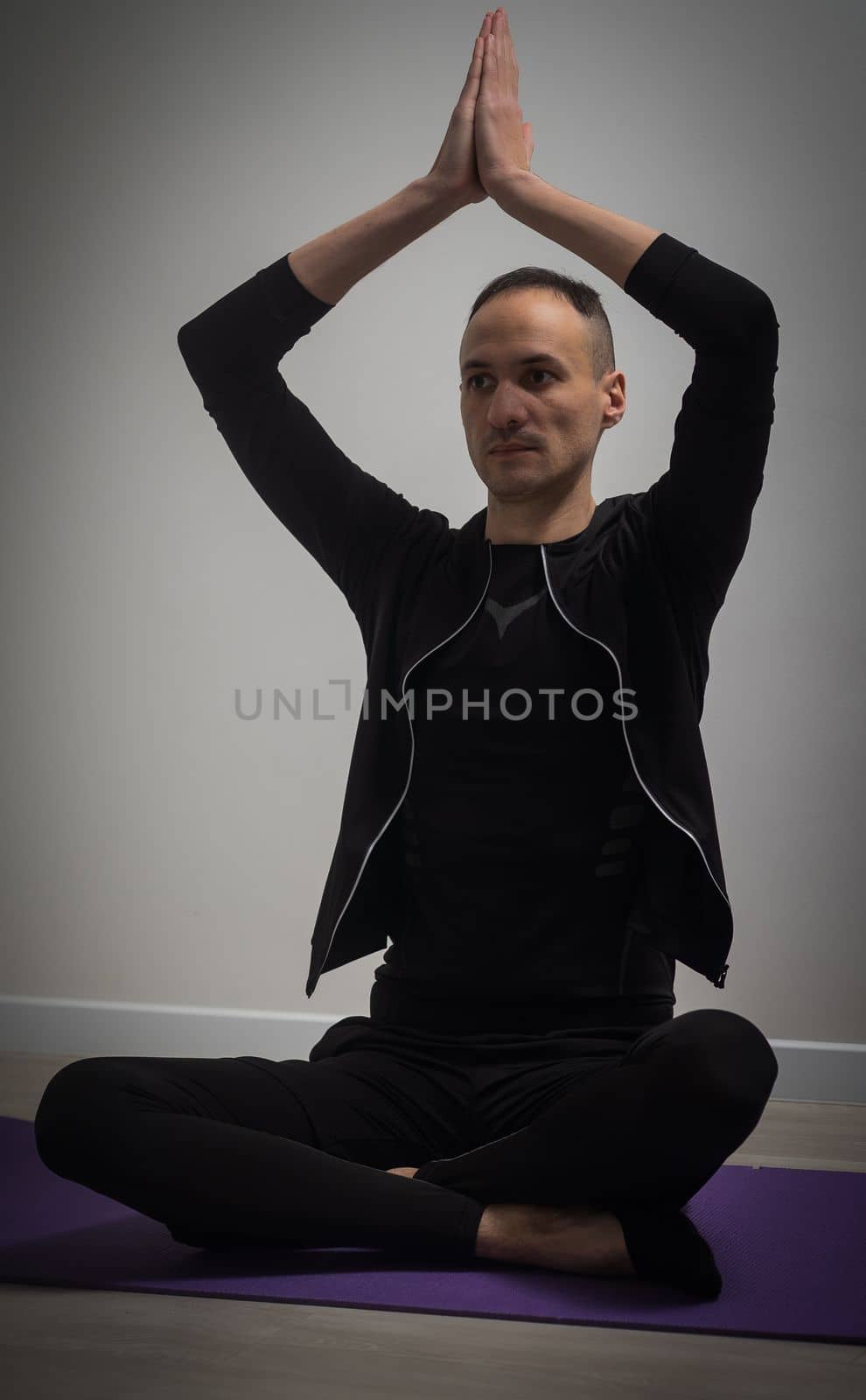 Full-length shot of male doing yoga