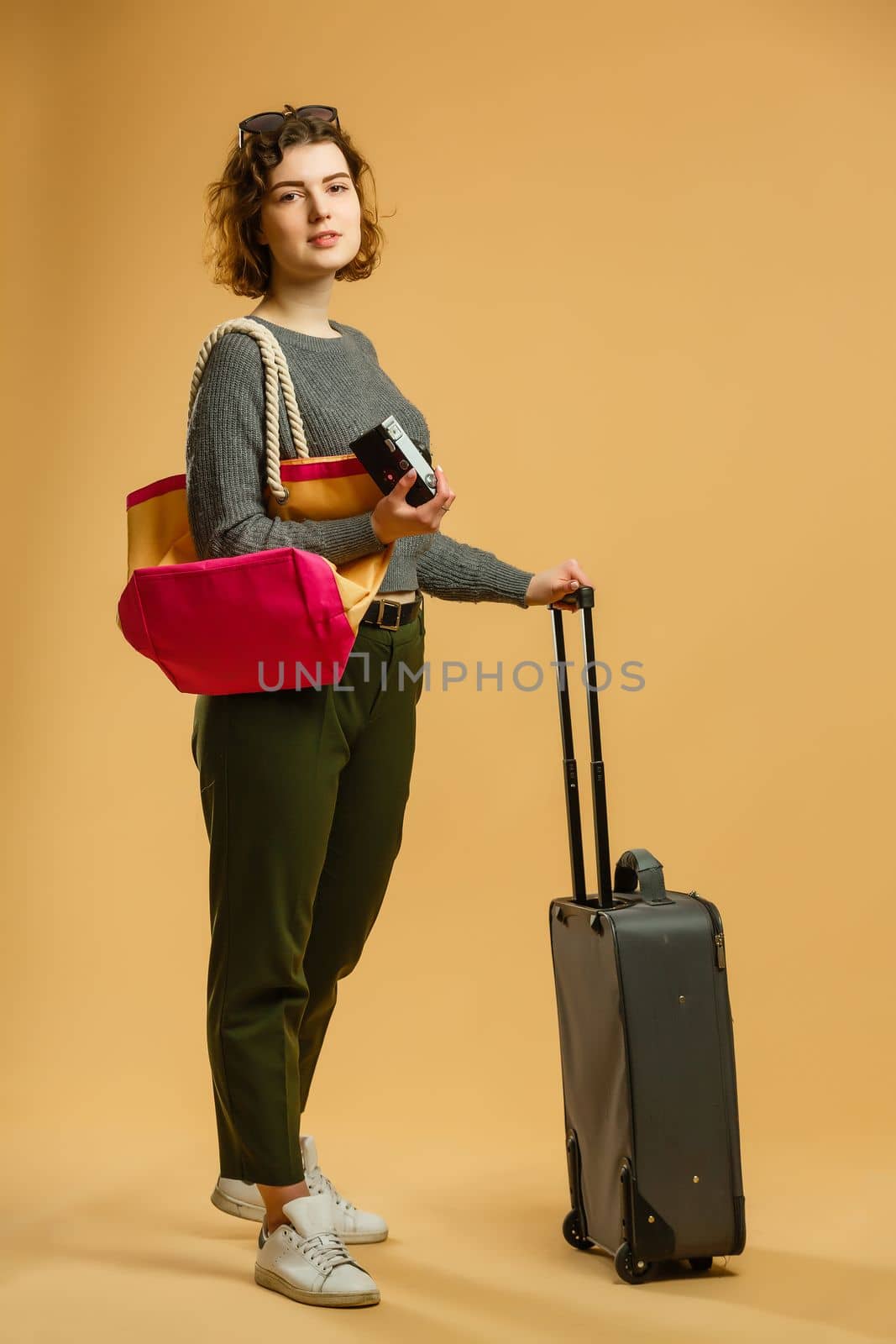 beautiful slim girl and straw hat posing with baggage and passport, isolated by Andelov13