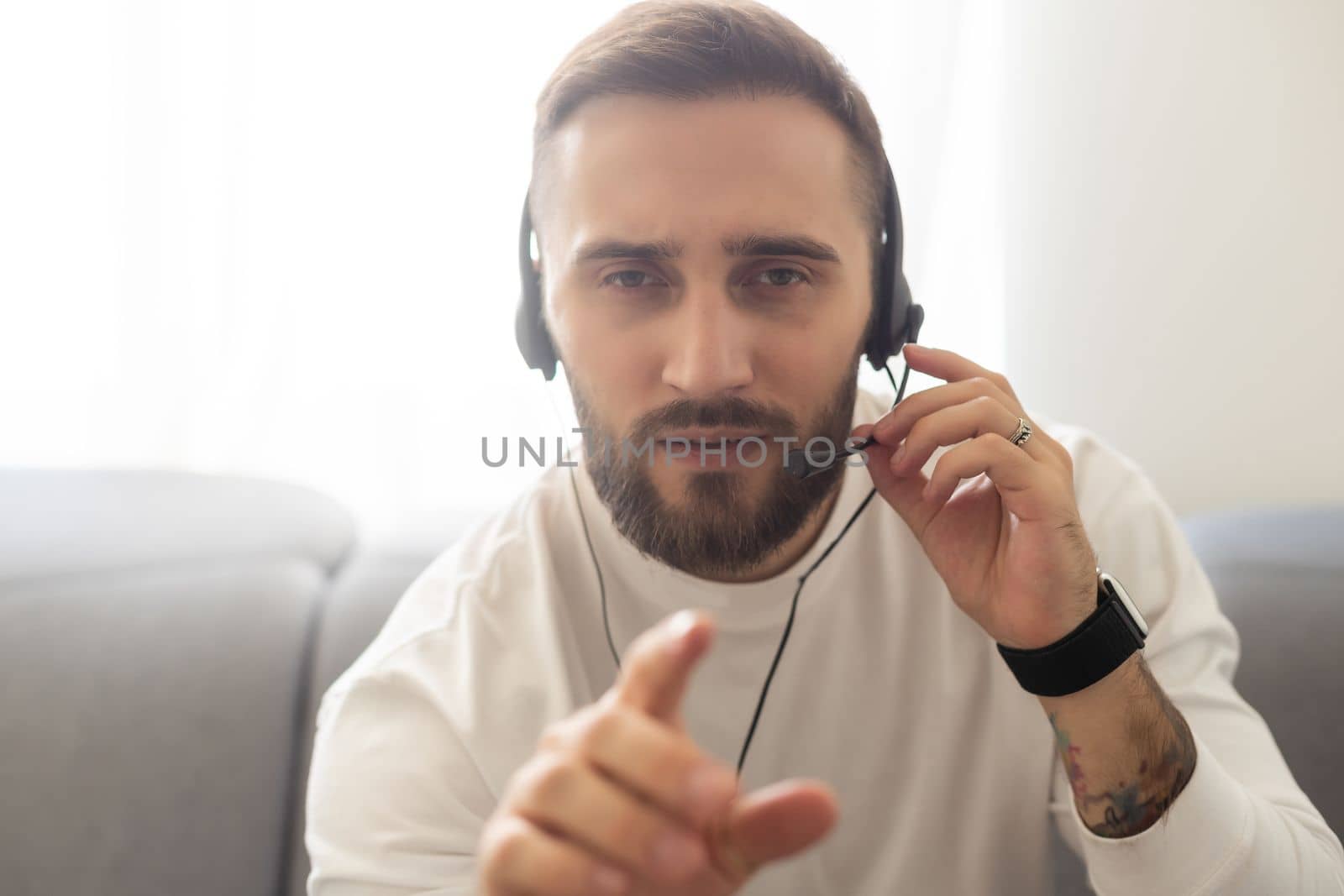 Close up headshot portrait of smiling man in headphones glasses have webcam conference at home office, profile picture of happy male in earphones speak talk on video call, virtual event concept by Andelov13