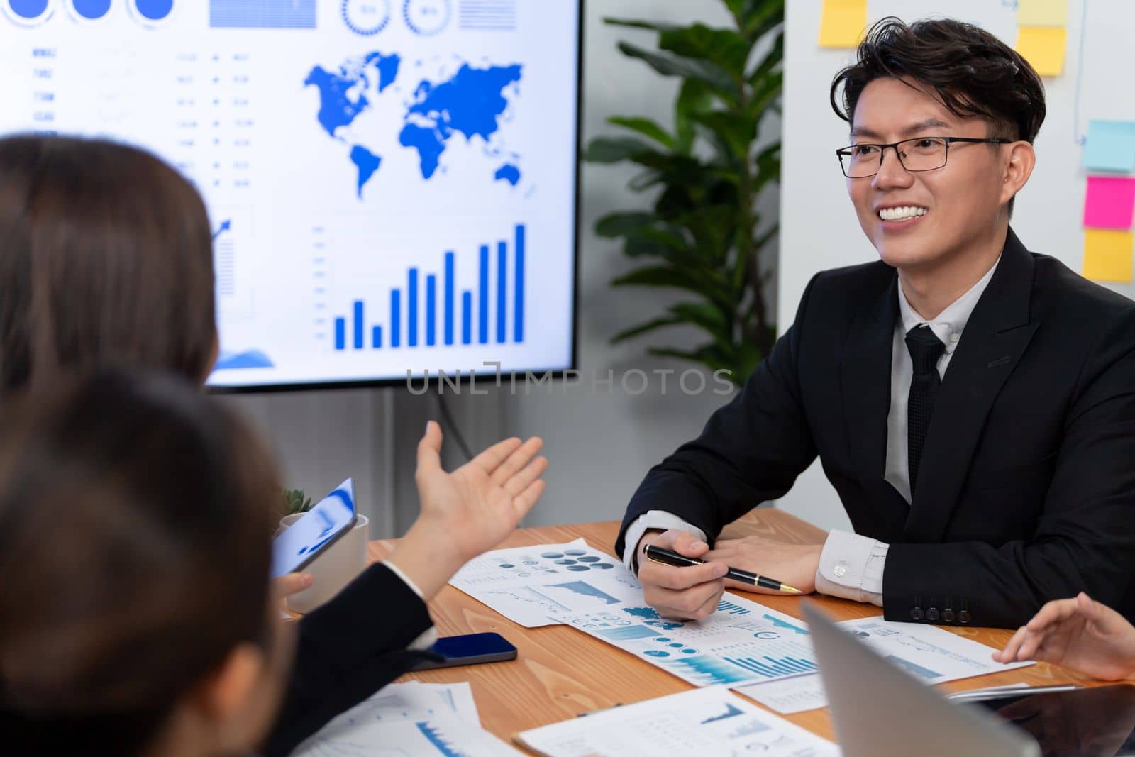 Business team of financial data analysis meeting with business intelligence, report paper and dashboard on laptop for marketing strategy. Business people working together to promote harmony in office.
