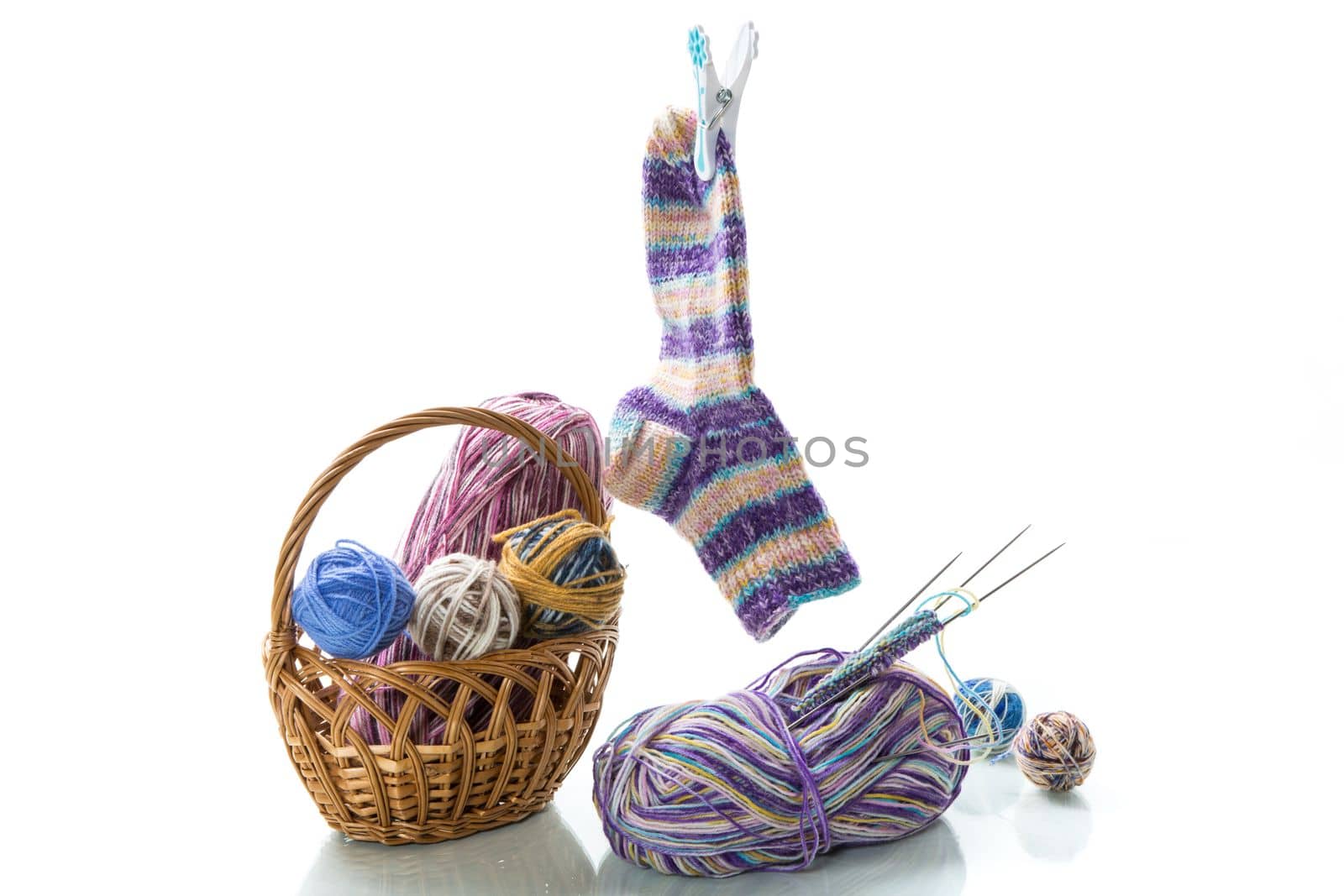 Colored threads, knitting needles and other items for hand knitting by Rawlik