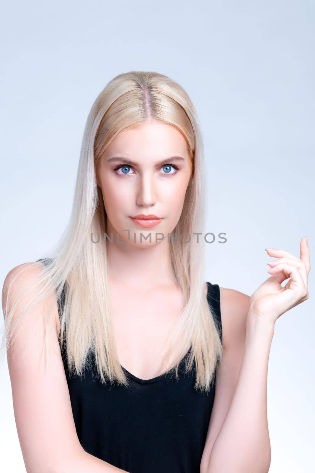 Pretty personable beautiful woman portrait with perfect smooth clean skin and natural makeup portrait in isolated background. Hand gesture with expressive facial expression for beauty model concept.