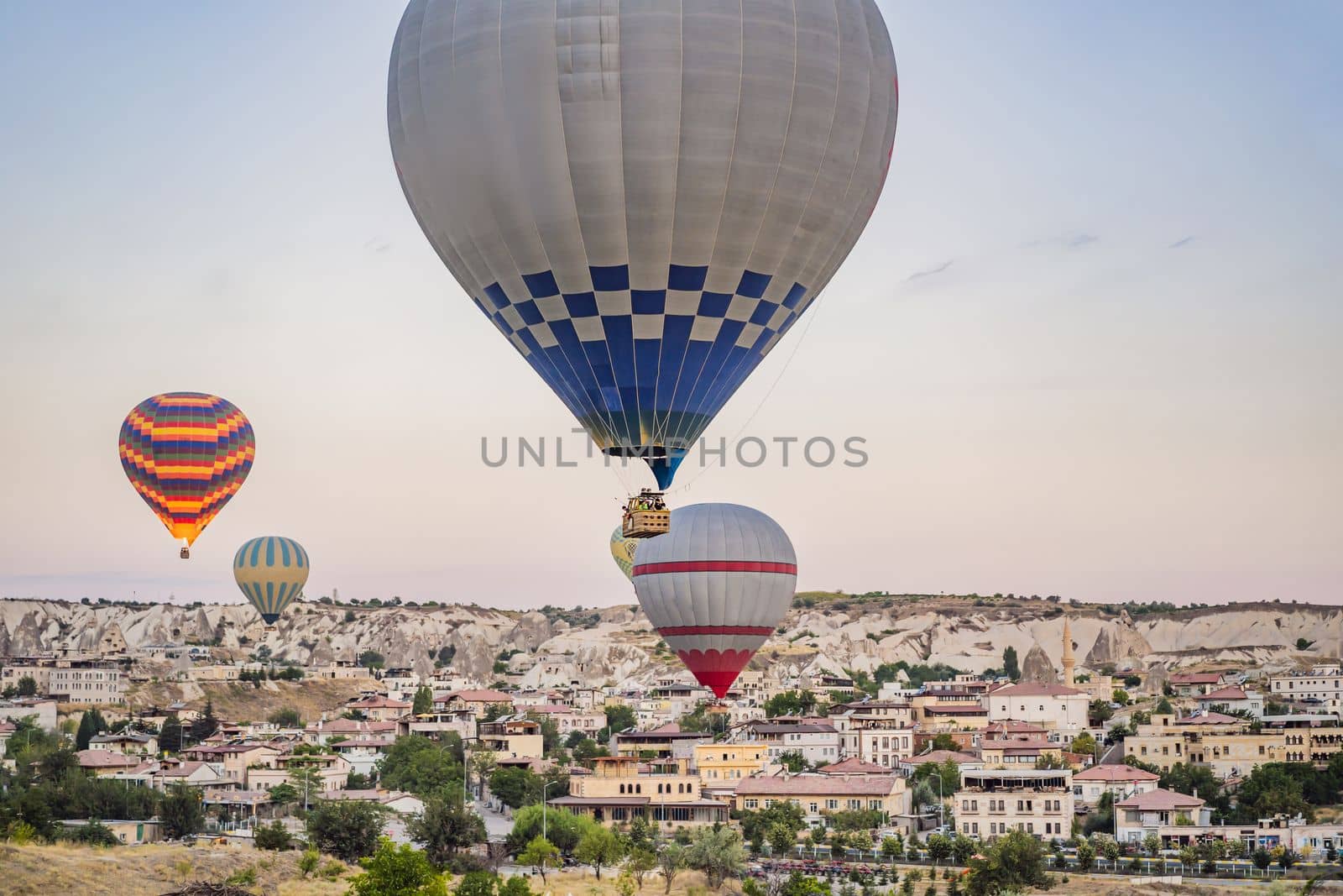 Colorful hot air balloon flying over Cappadocia, Turkey by galitskaya