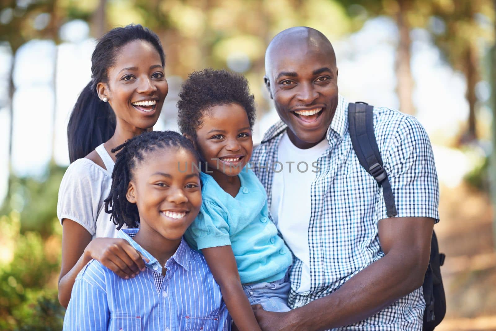 A family that shares a passion for the great outdoors. a happy african american family enjoying a day out in the forest