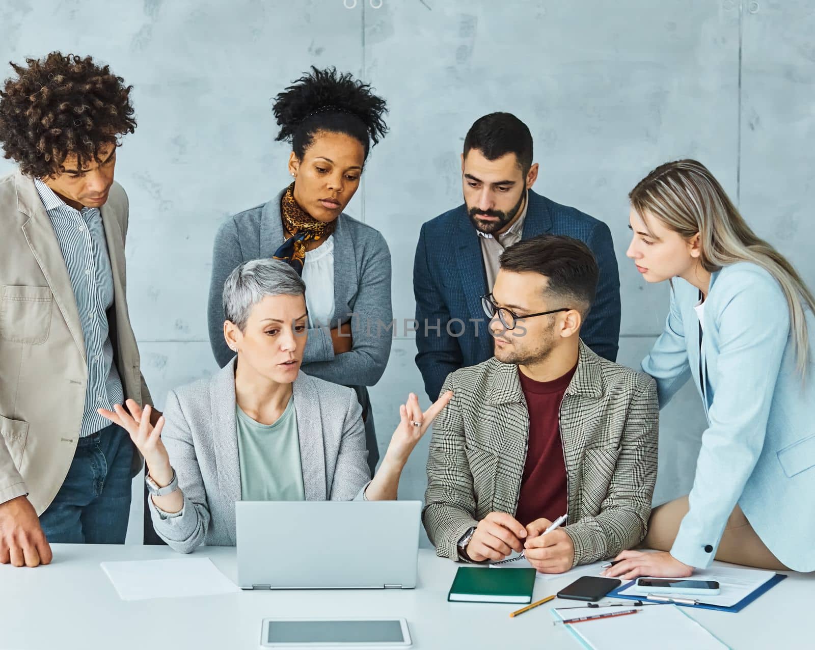 Group of young business people having a meeting or presentation and seminar in the office