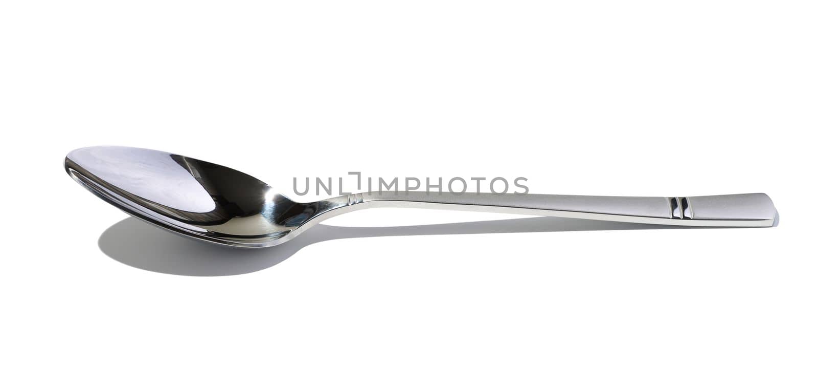 Metal spoon for soup on a white isolated background, close up