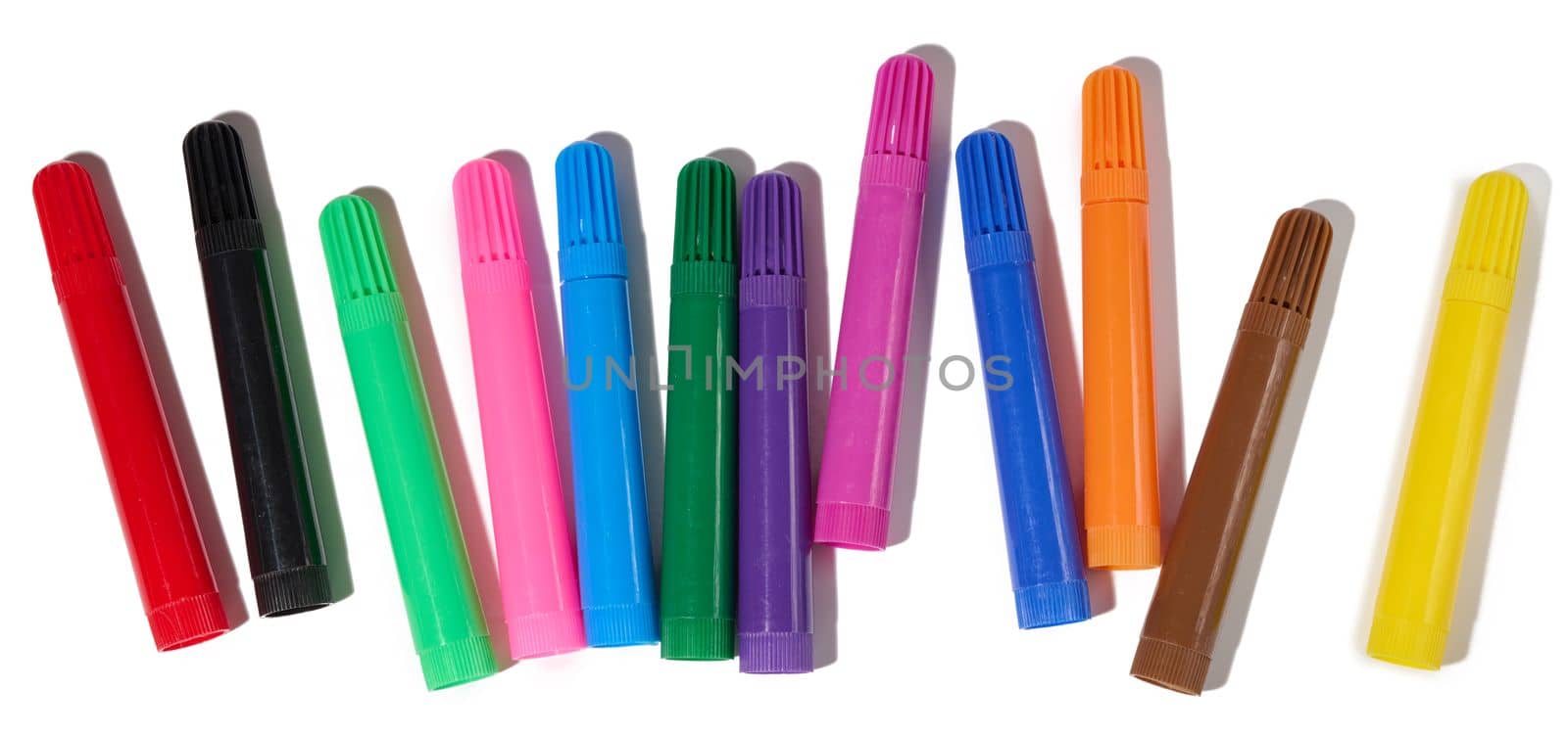 Stack of multicolored felt-tip pens isolated on white background, top view