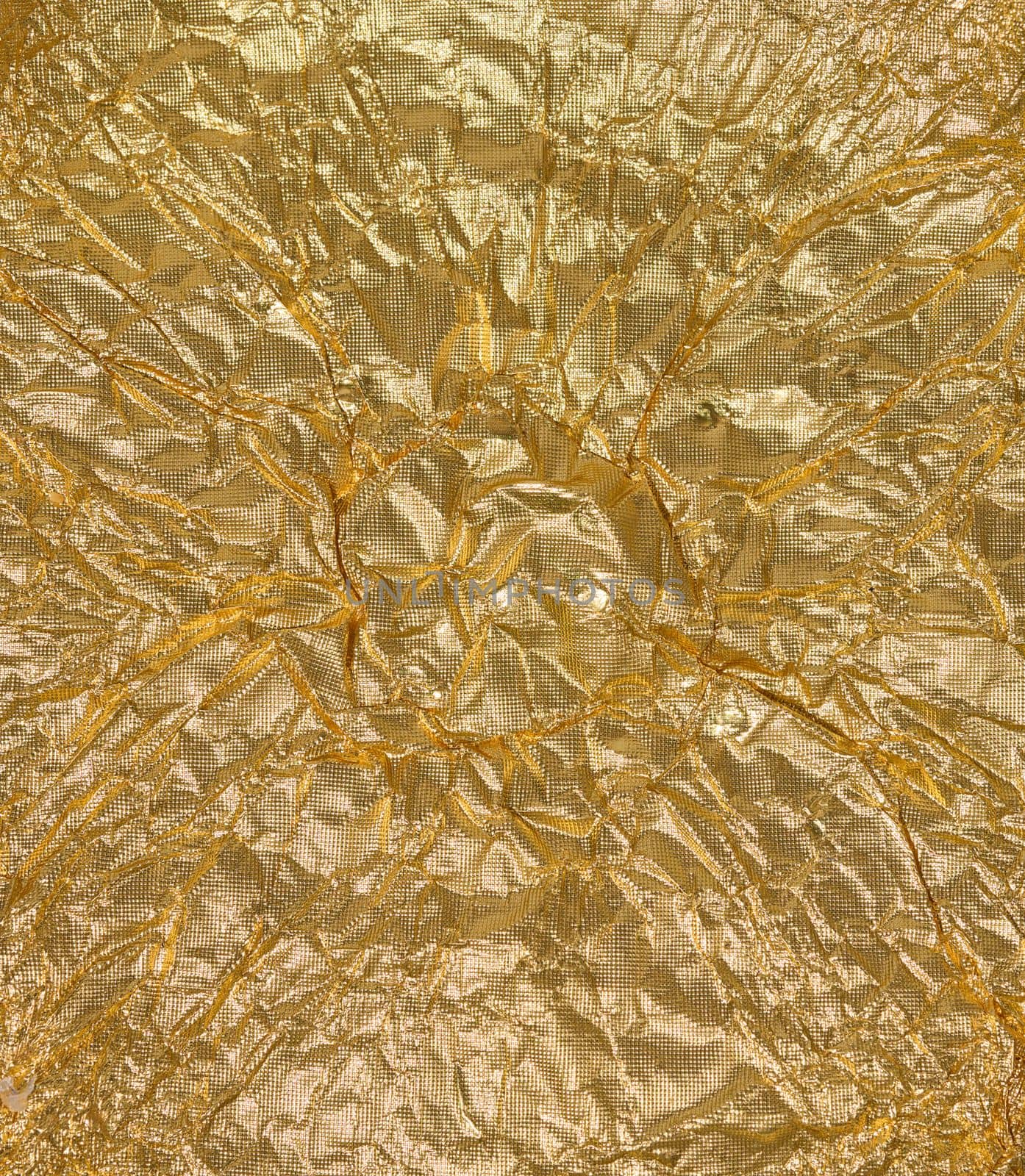 Crumpled golden foil texture, full frame