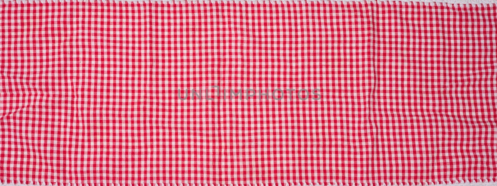Cotton red-white kitchen towel, close up by ndanko