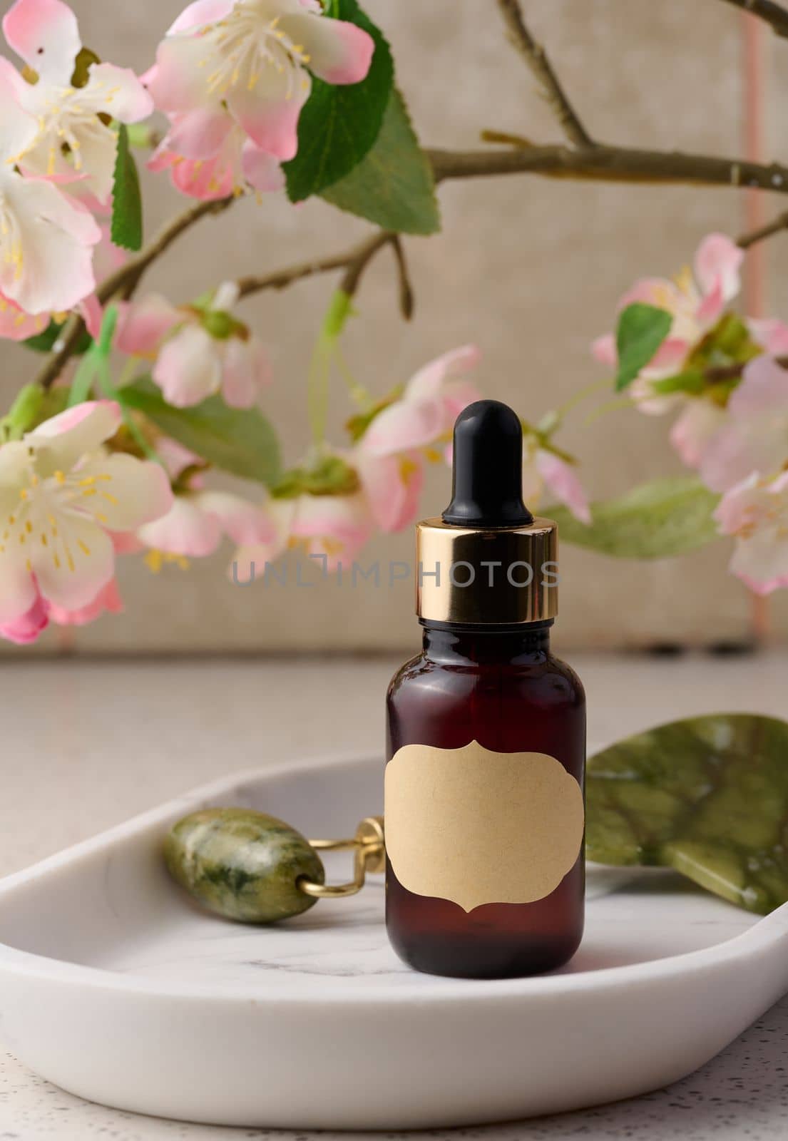 Brown glass bottle with a pipette on the table, a container for cosmetics, aroma oils. Advertising and promotion of products, branding