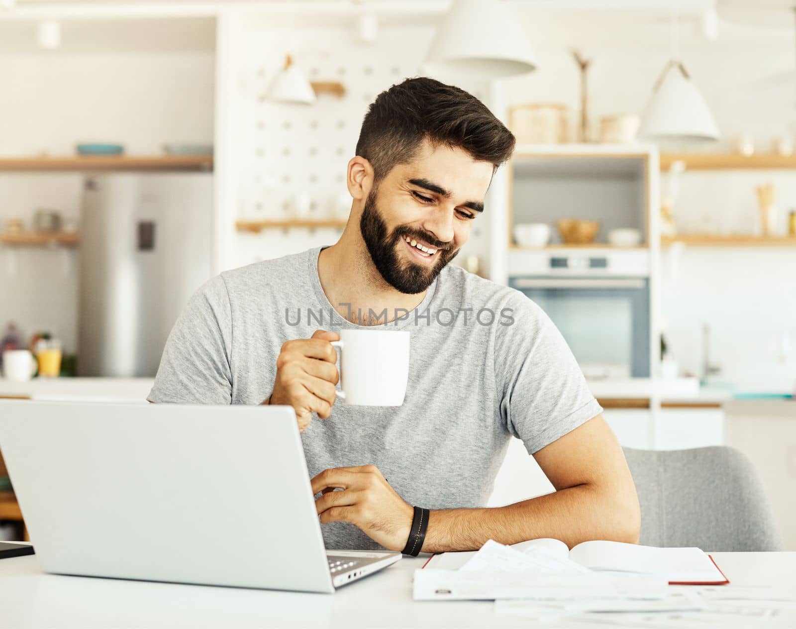 laptop man computer home technology young student business internet study document paperwork reading by Picsfive