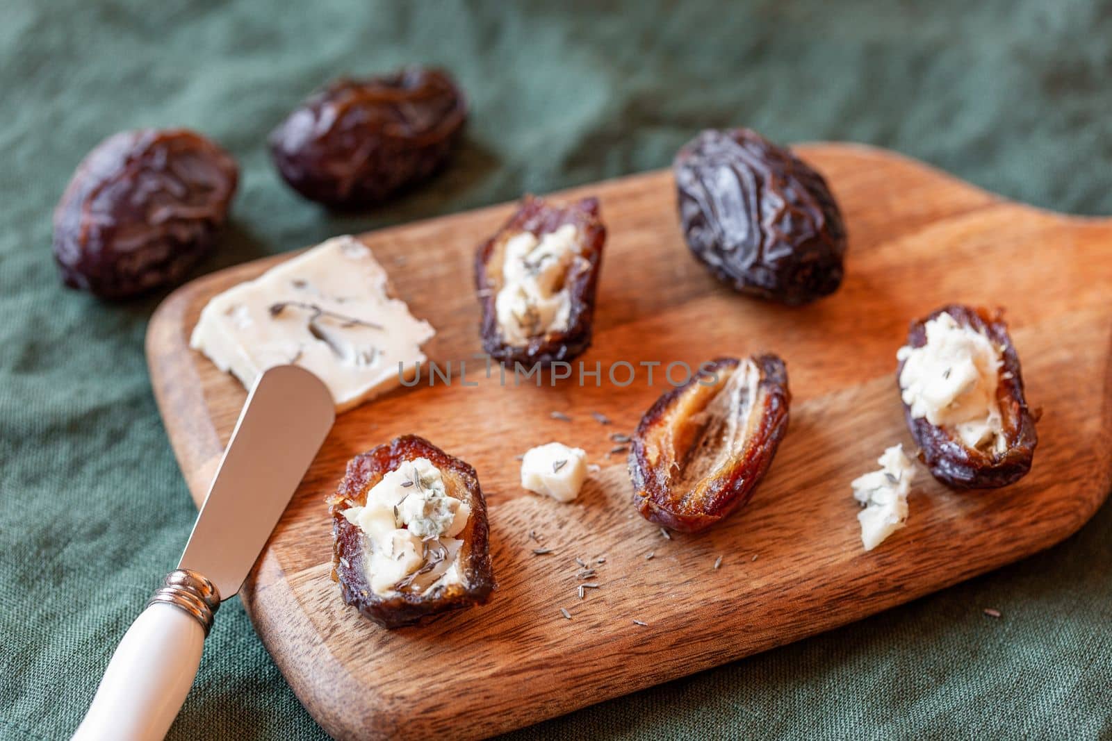 date fruits stuffed with gorgonzola cheese, side view
