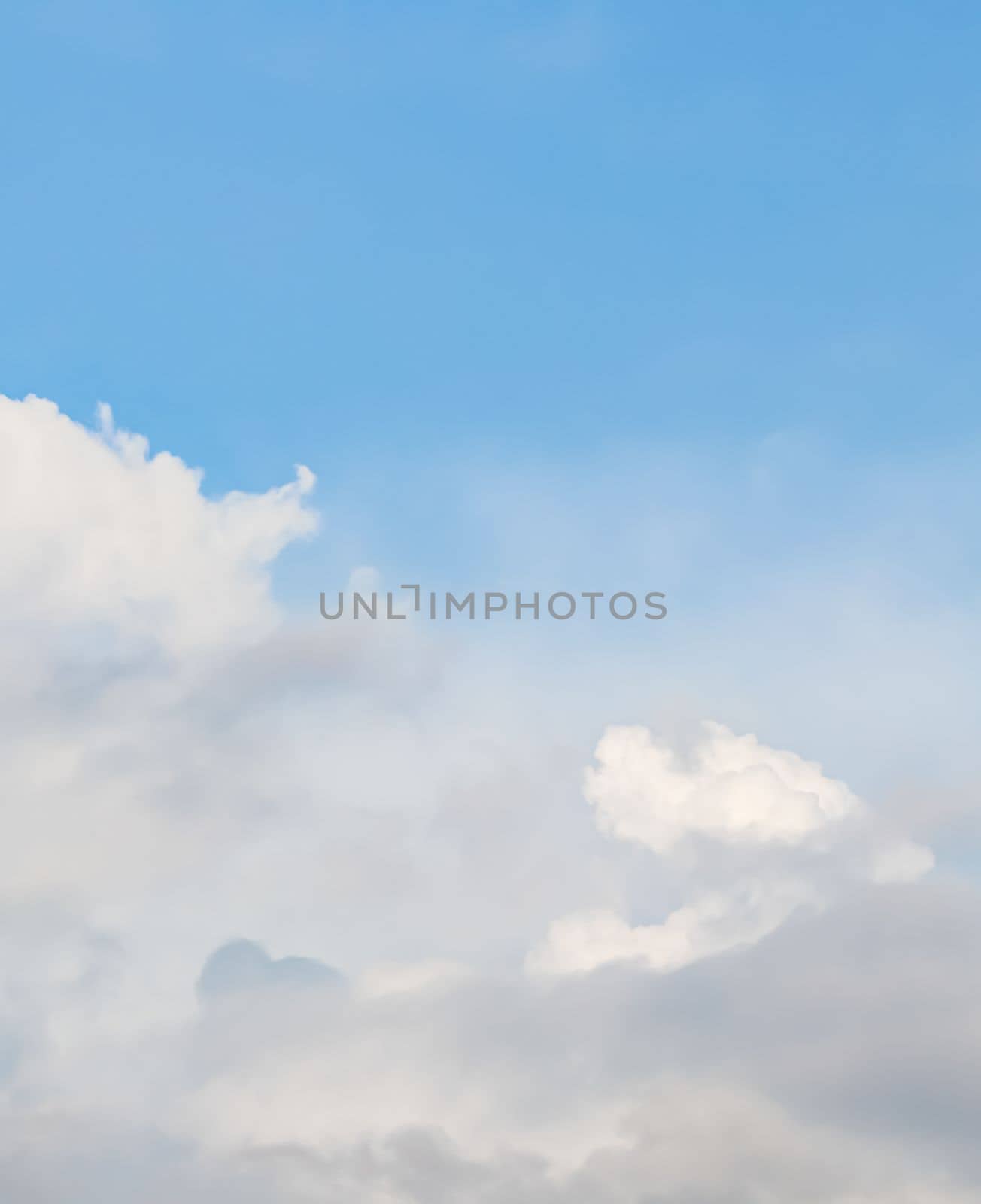 Background of blue sky with white clouds. Natural backdrop