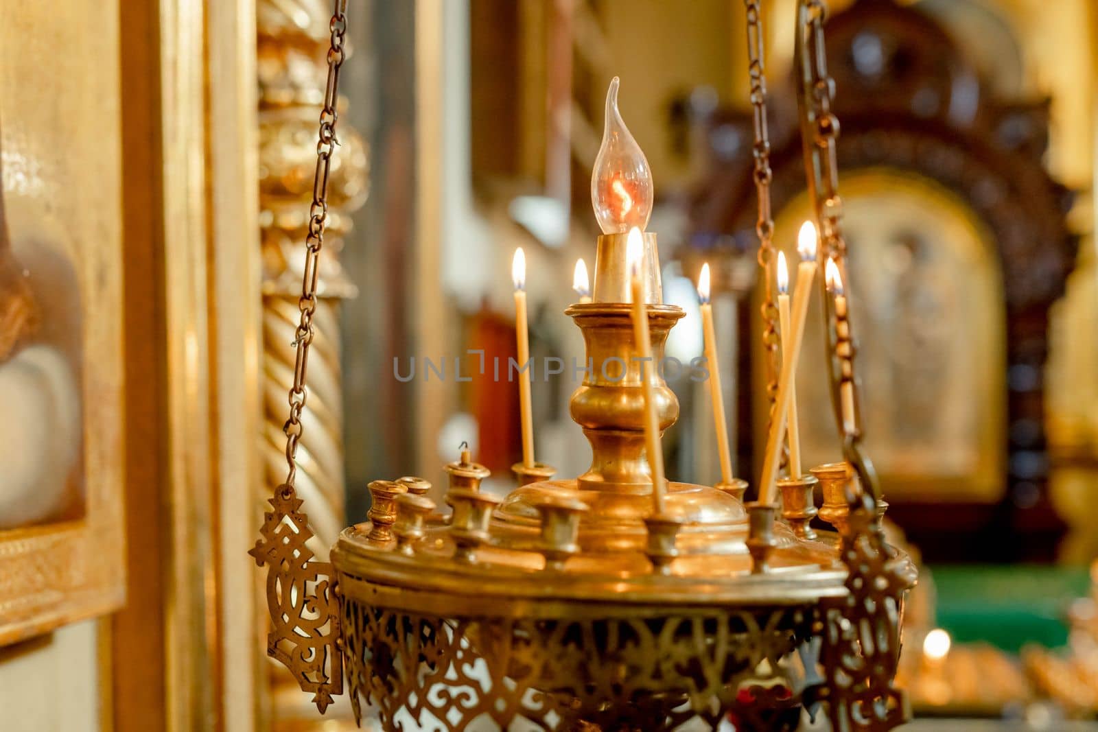 Orthodox Church. Christianity. Festive interior decoration with burning candles and icon in traditional Orthodox Church on Easter Eve or Christmas. Religion faith pray symbol