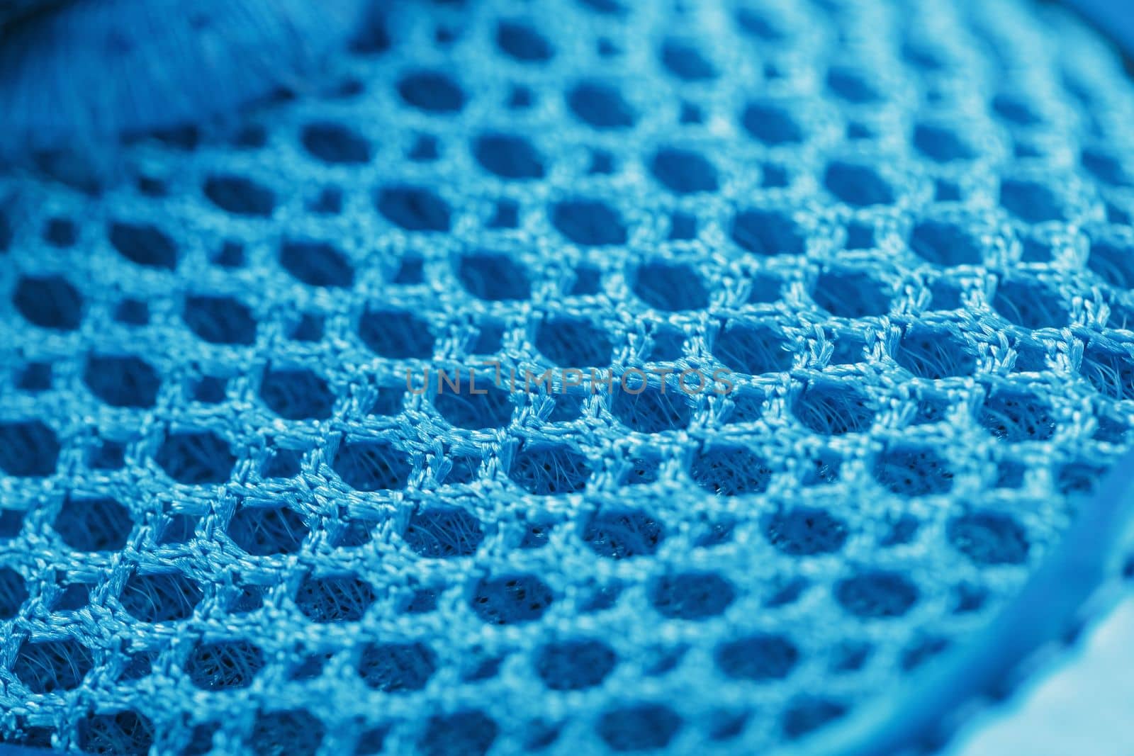Macro Ventilation grid of blue sneakers in full screen by AlexGrec
