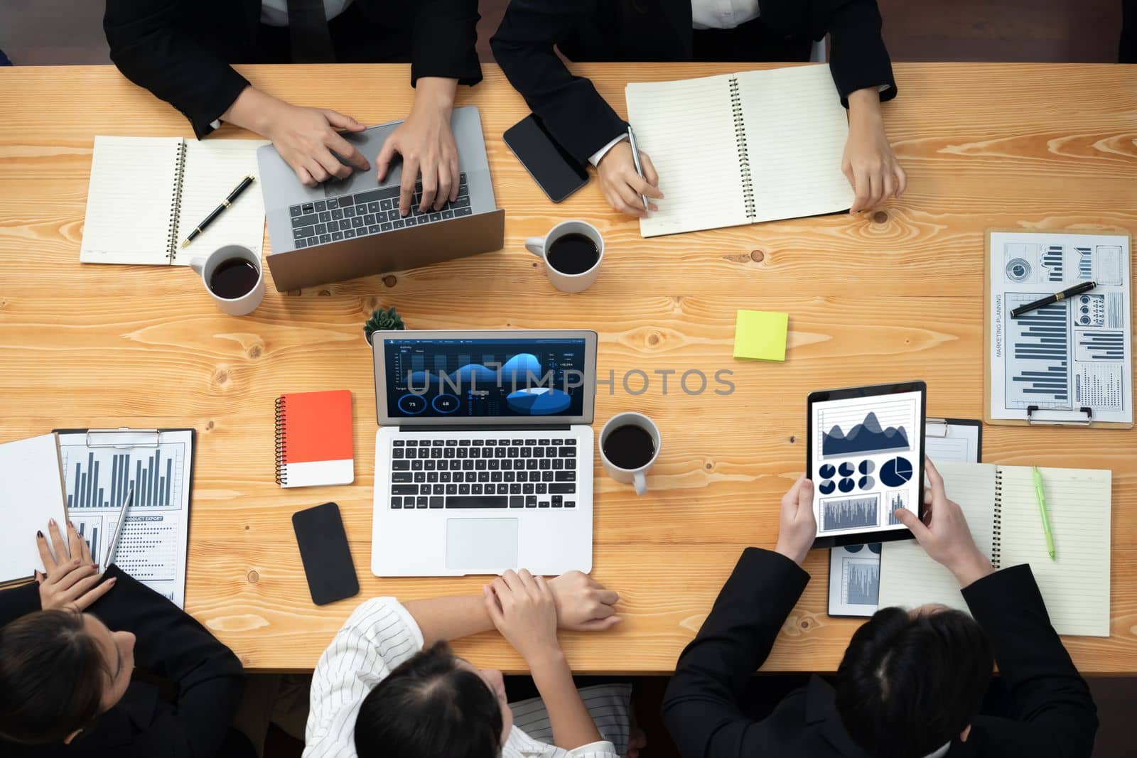 Top view manager or office worker give presentation in harmony conference room to business colleague, BI data dashboard on screen and pile of financial analyzed data reports on meeting table.