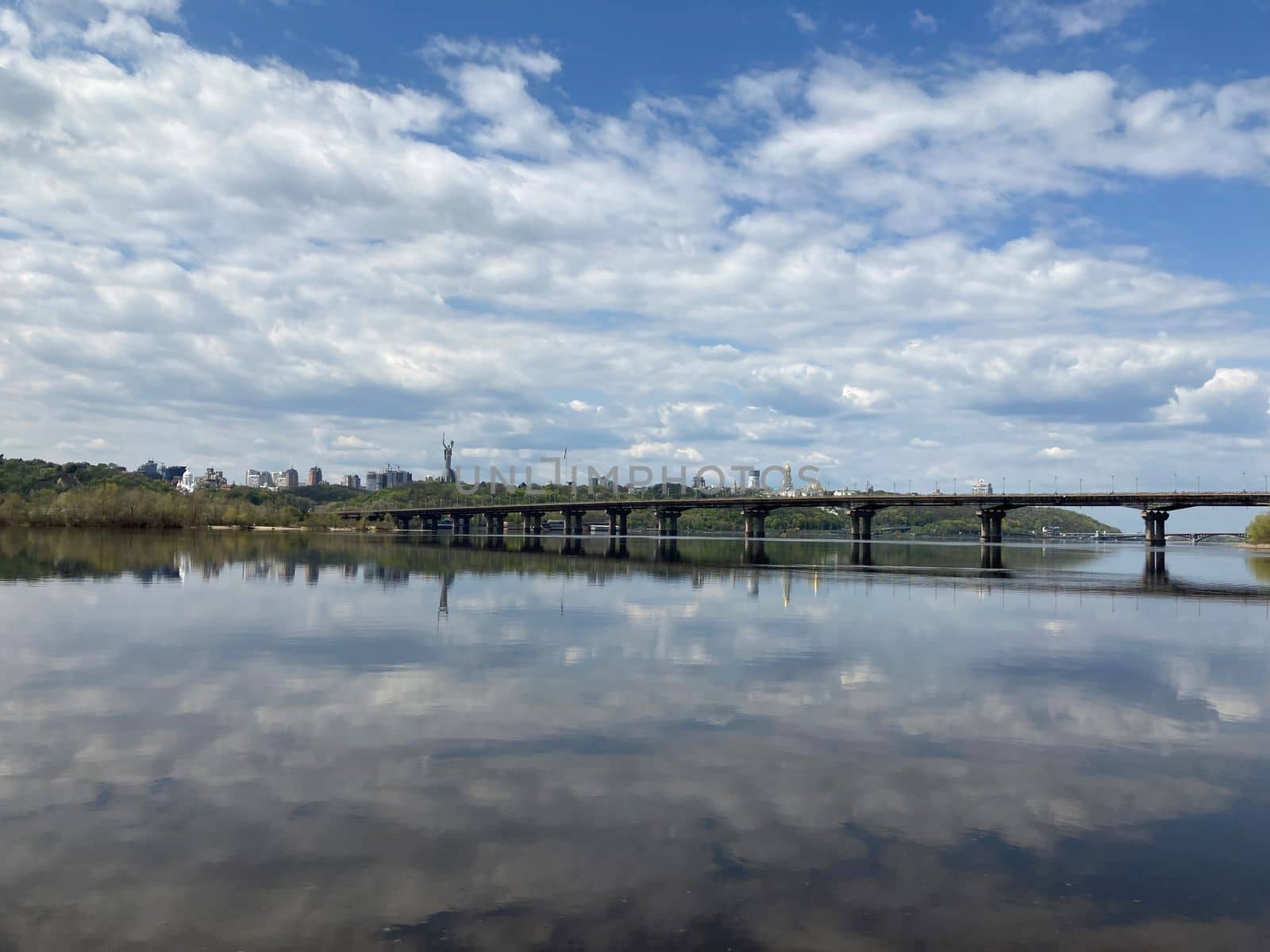 Kiev city bridge over the Dnieper river. Scenic view of the city landscape. The famous bridge. Residential buildings. view to the big river, blue water