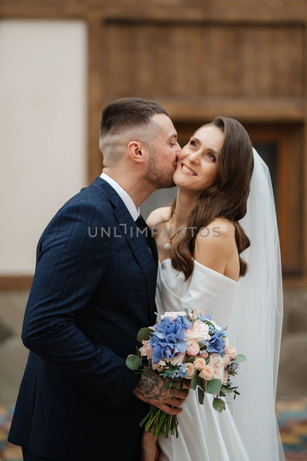 the first meeting of the bride and groom in wedding outfits in the park