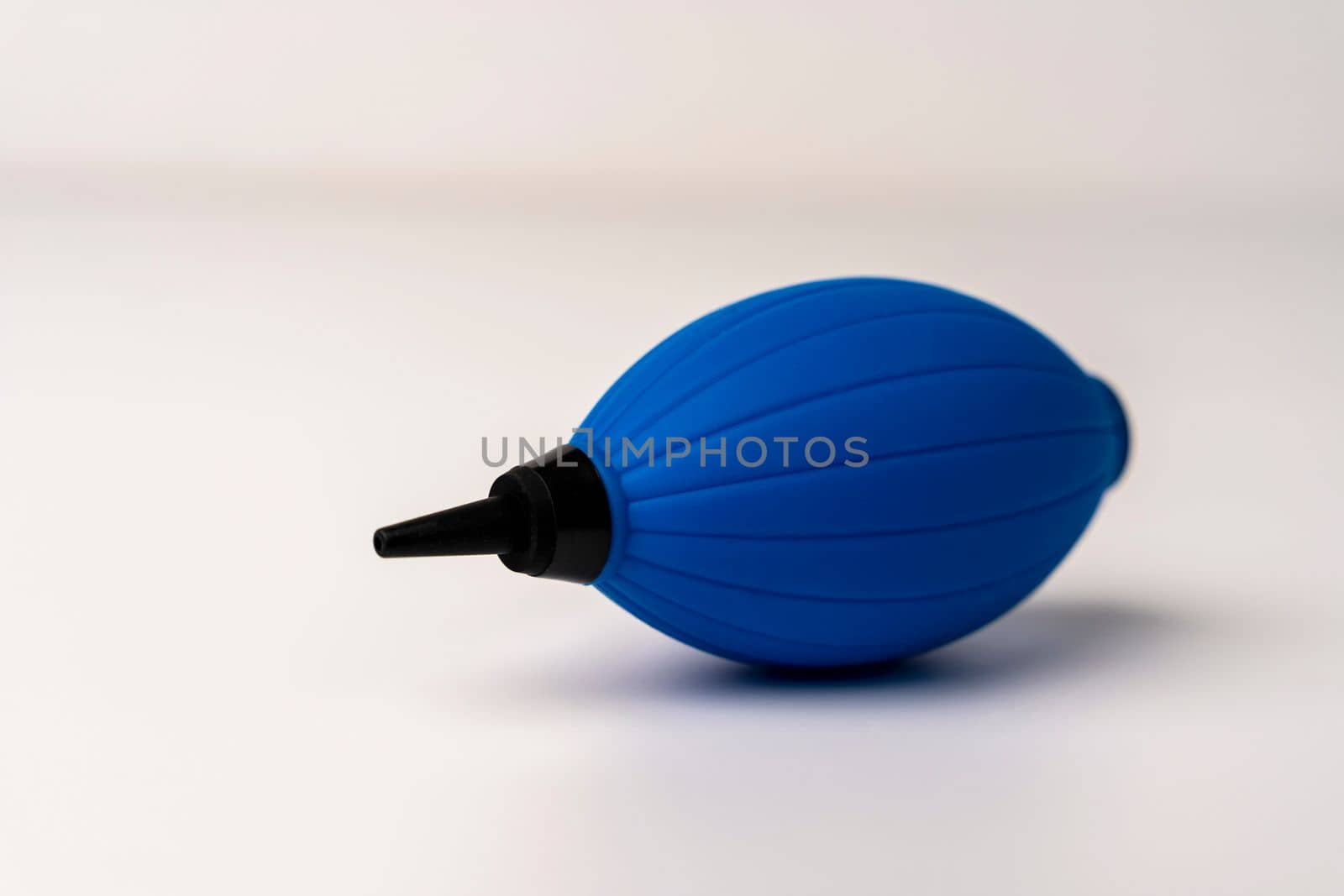 a pear for blowing a photo lens. Pear for cleaning the camera from pollution. white background. High quality photo