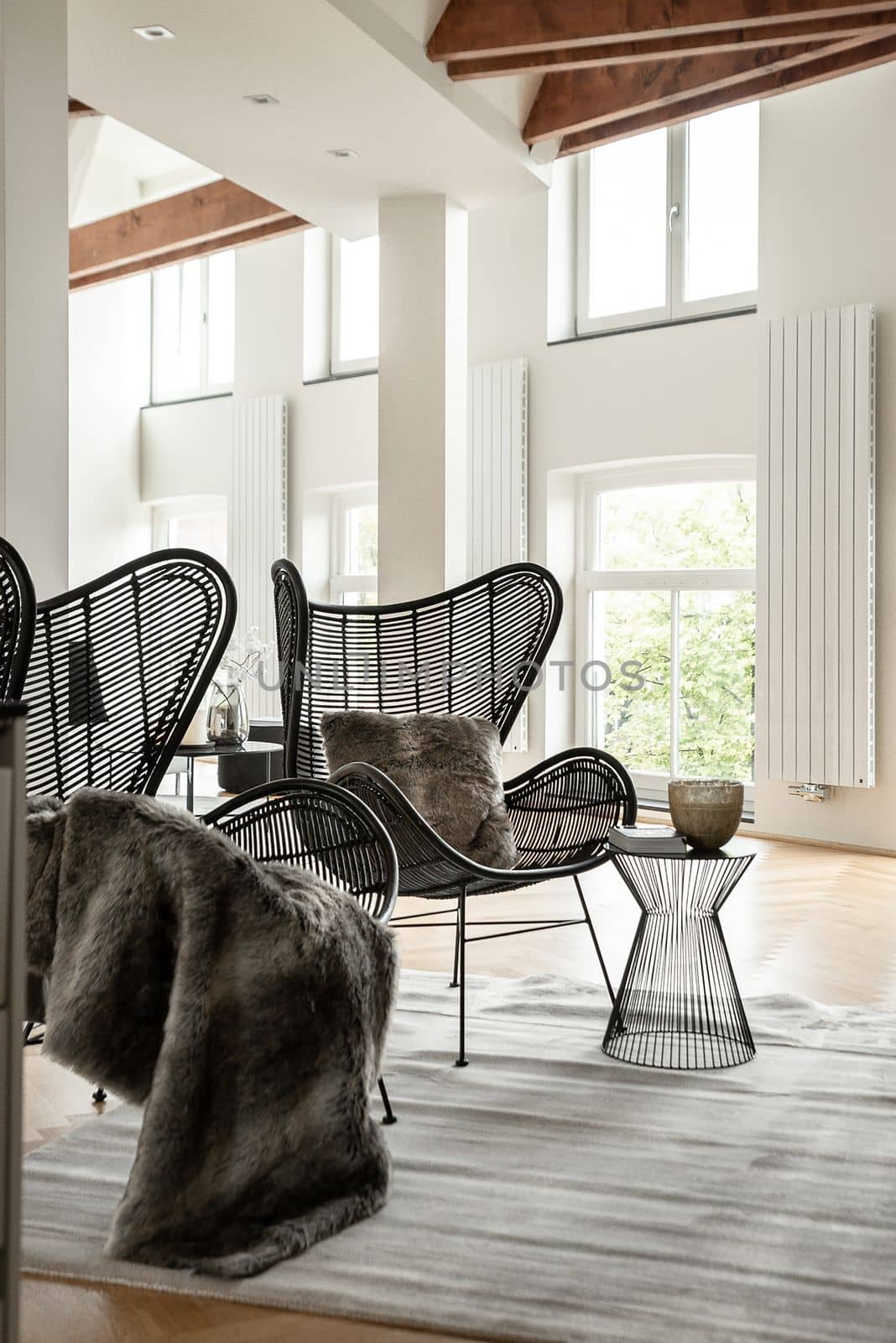 Two black designer chairs in a cozy chilling space of modern luxury house