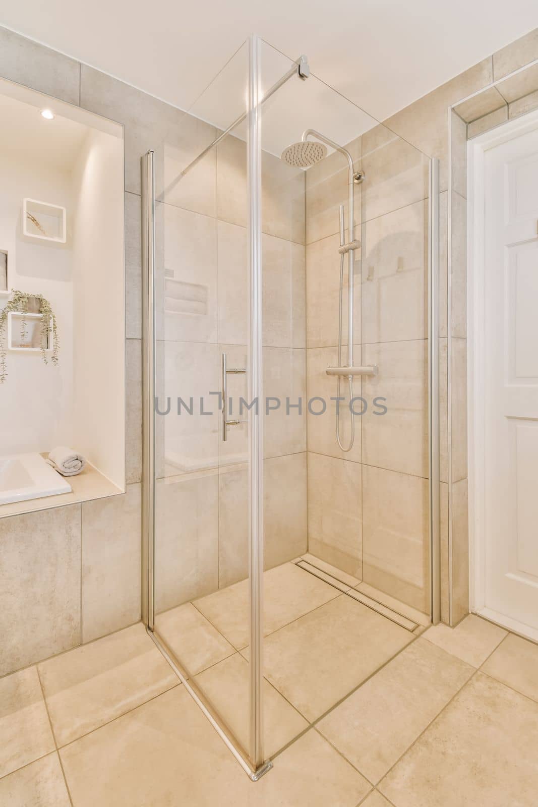 a bathroom with a shower stall and toilet in the corner next to the bathtub on the right is an open door
