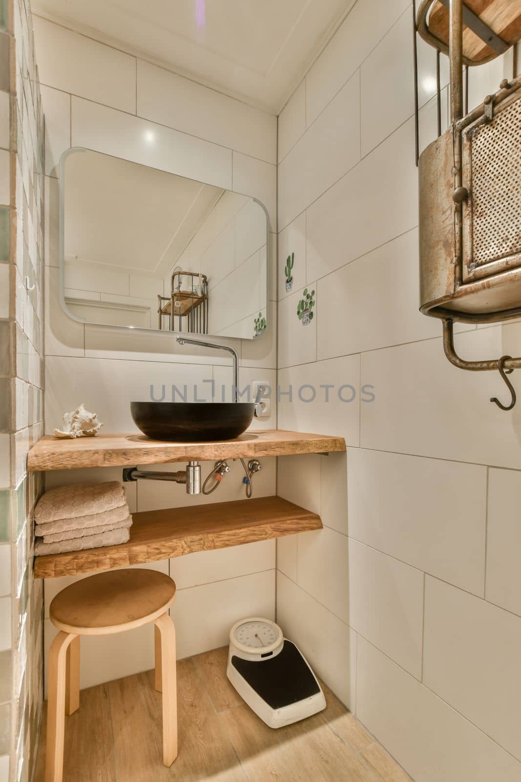 a small bathroom with a sink and a mirror by casamedia