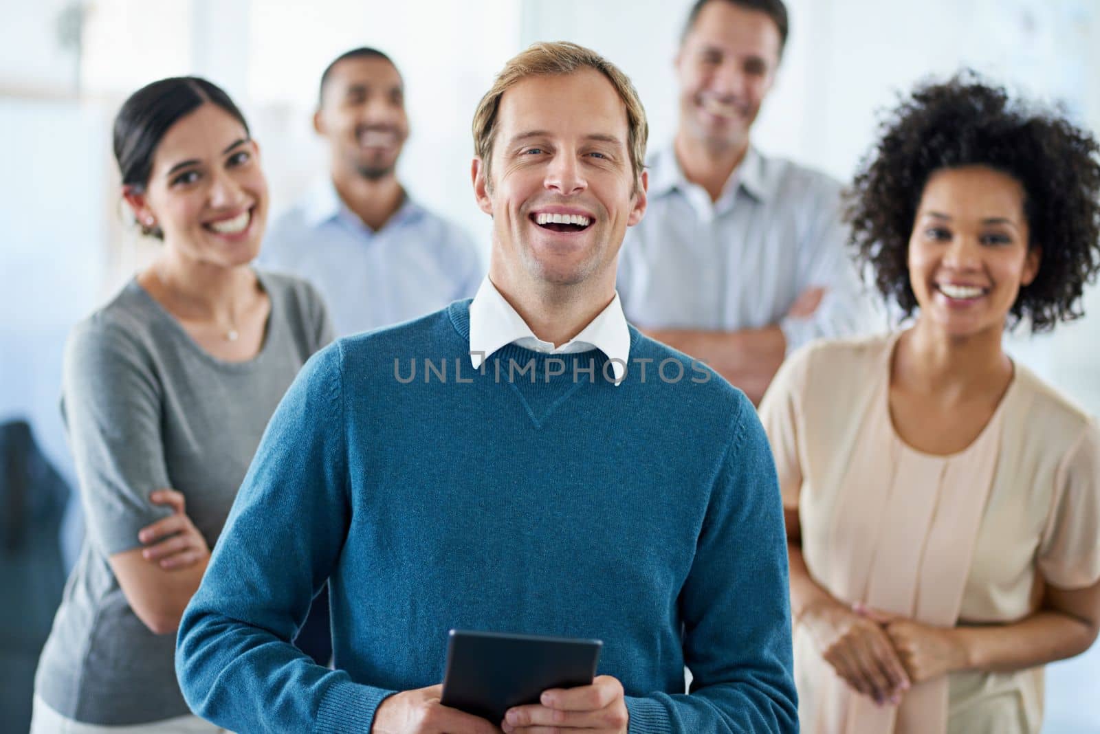 Positivity inspires success. Portrait of a group of diverse colleagues standing in an office