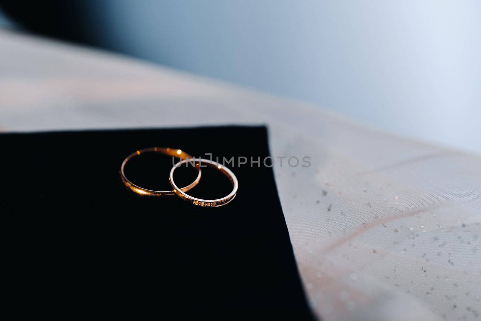 Close-up of two gold wedding rings for a wedding.