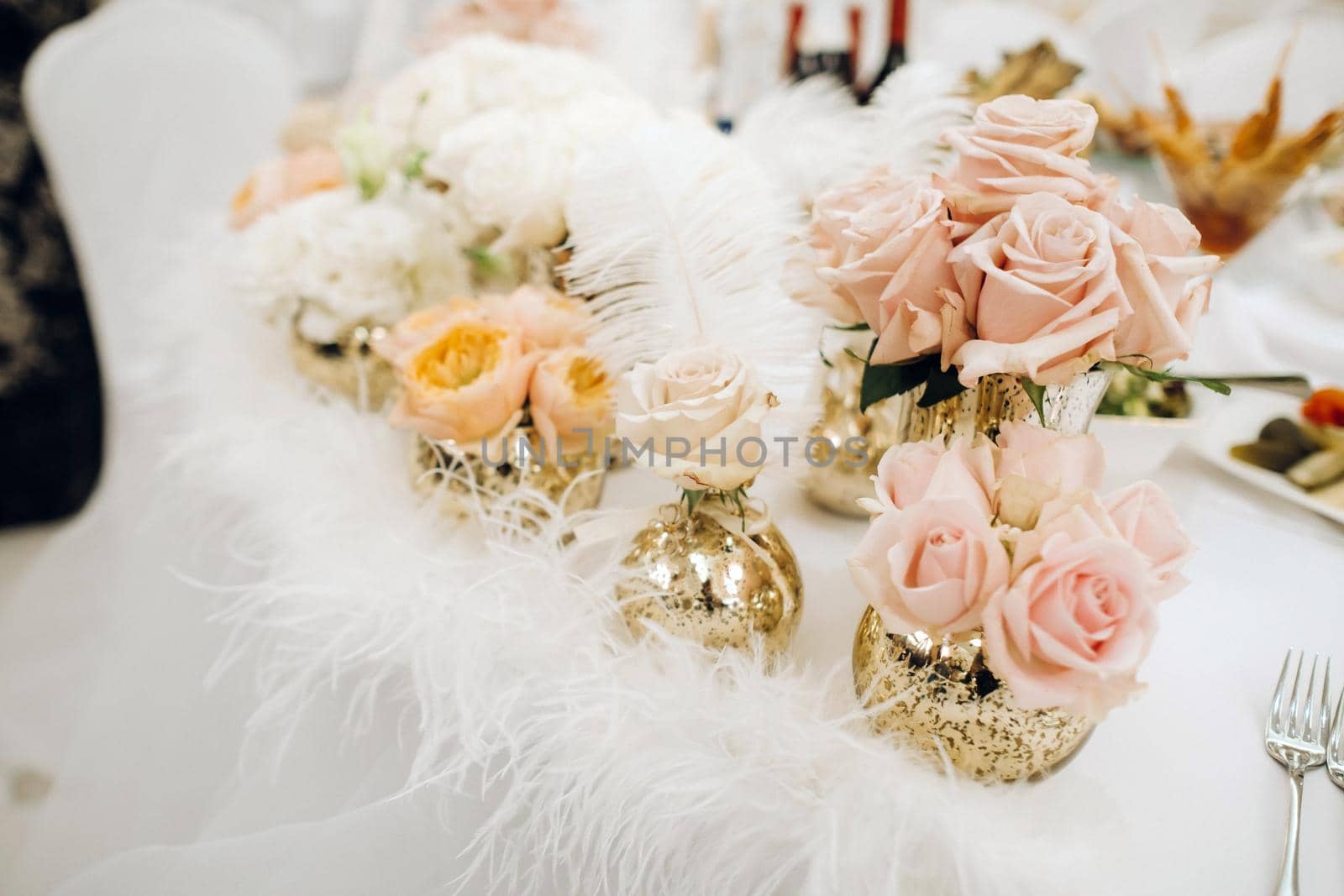 wedding table decoration with flowers on the table in the castle, table decor for dinner by candlelight.Dinner with candles.