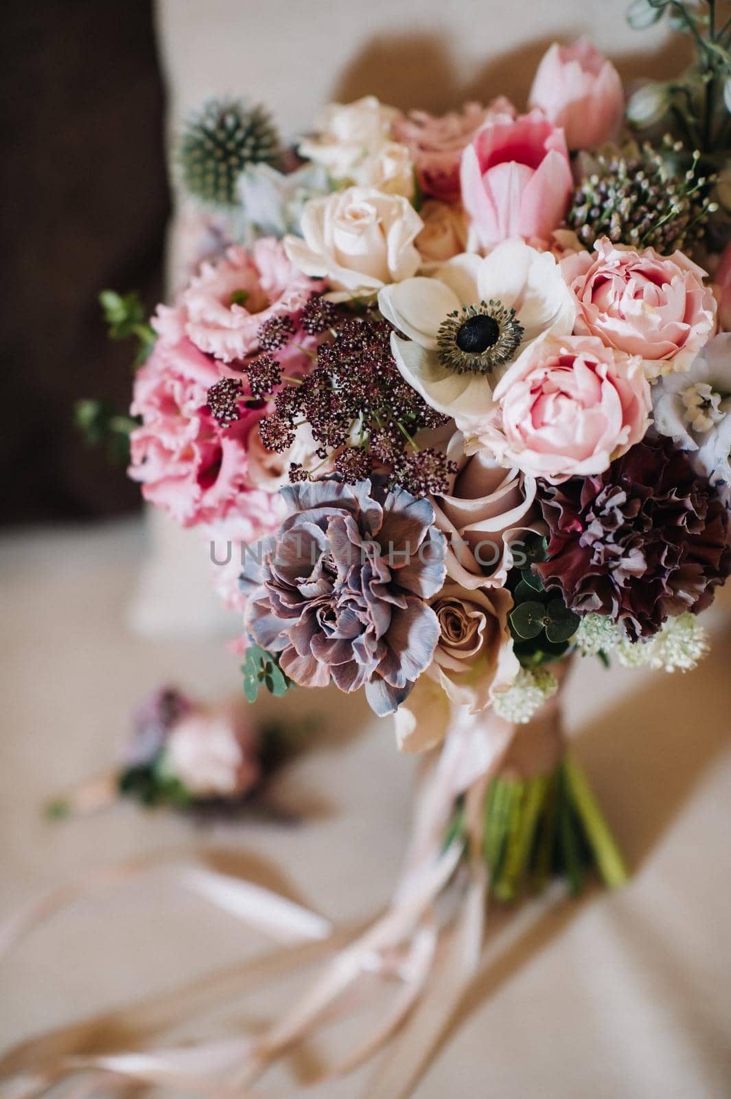 wedding bouquet with roses and boutonniere.The decor at the wedding.