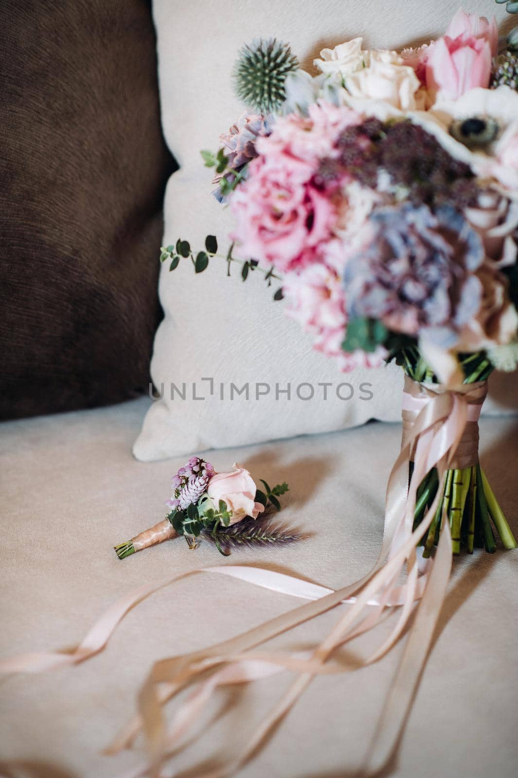 wedding bouquet with roses and boutonniere.The decor at the wedding.