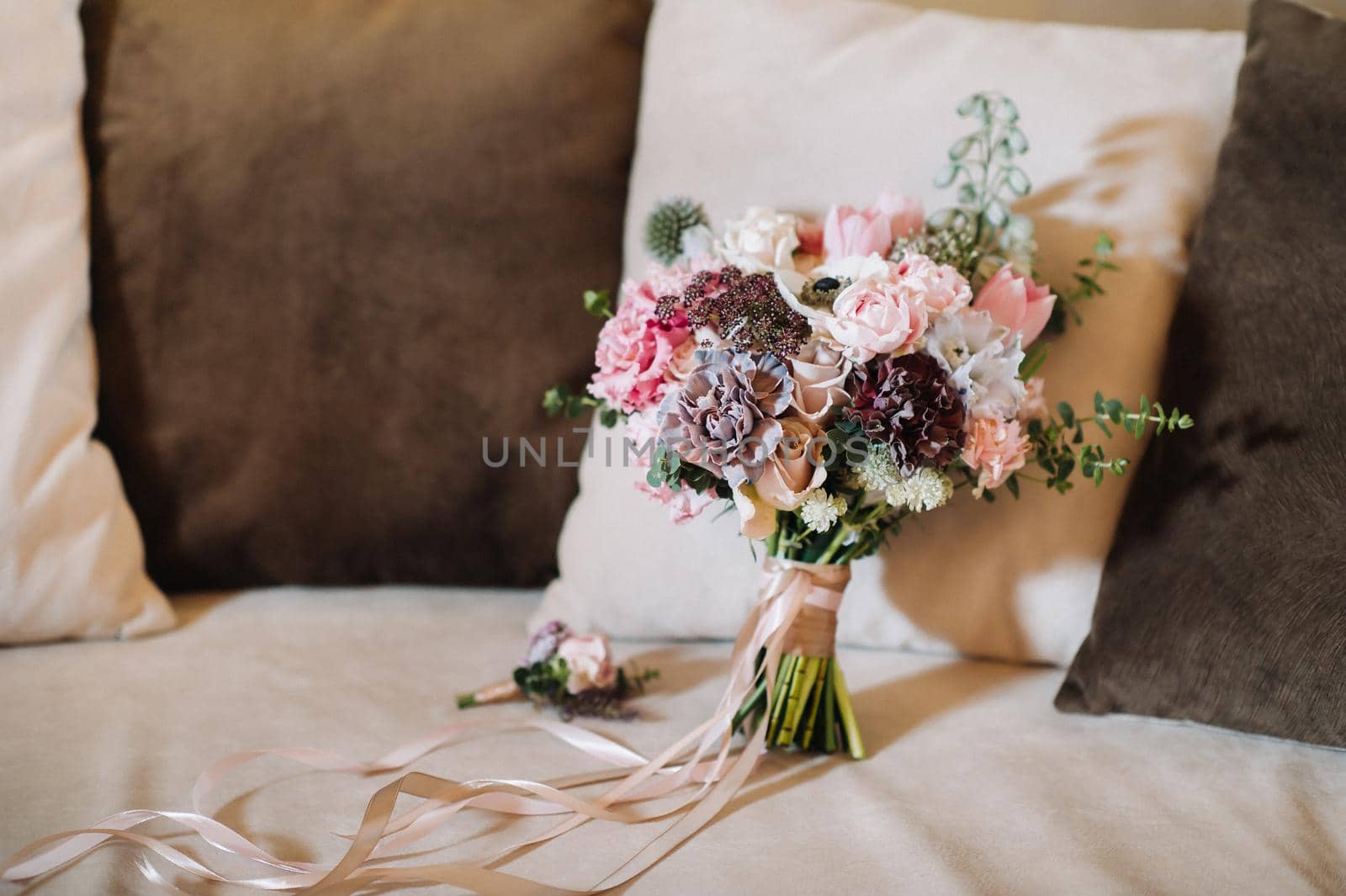 wedding bouquet with roses and boutonniere.The decor at the wedding.