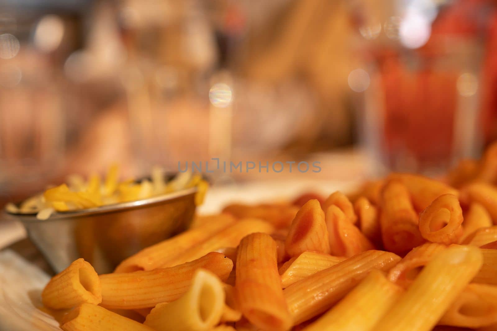 Close up of macaroni with tomato and cheese server on a restaurant.