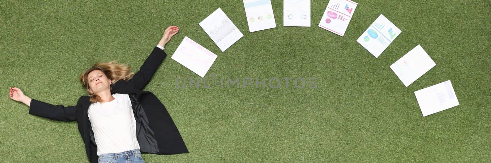 Woman is lying on green lawn along with chart business analytics. Advertising business banner place for text