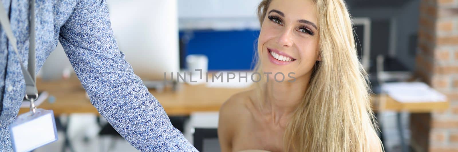 Man gives bio to interviewer at job interview. Partner brought business document to businesswoman