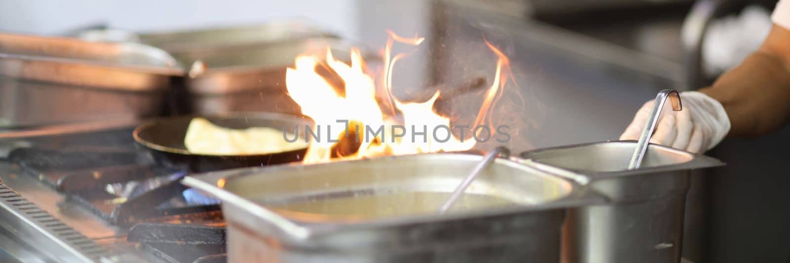 Cooking in the kitchen in restaurant on fire by kuprevich