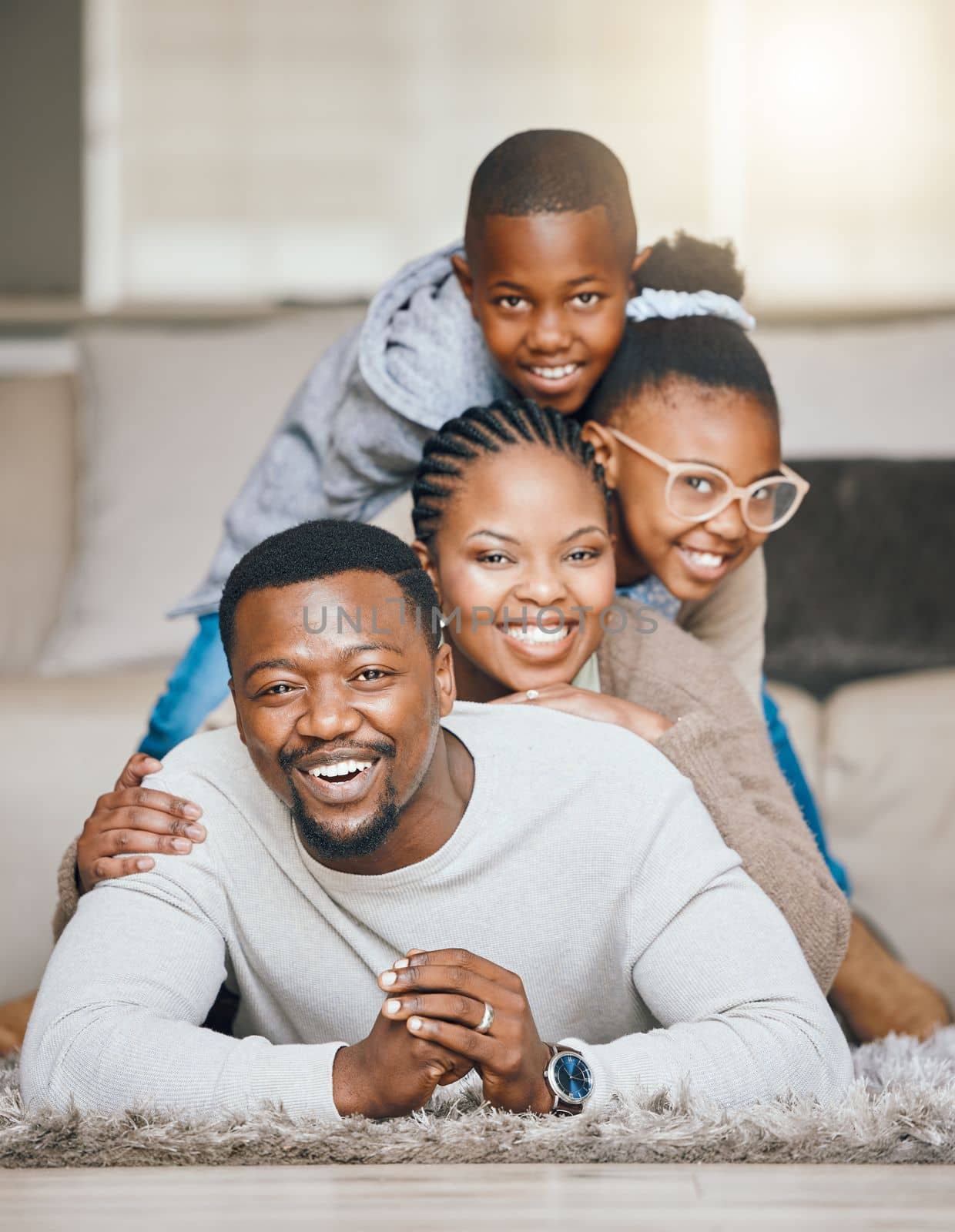 Hes our support. a young family relaxing together at home