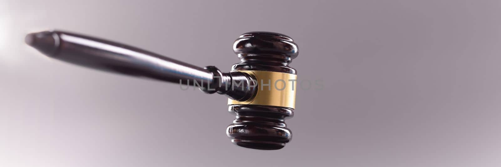 Wooden gavel for court or auction on gray background.Symbol of power and the right to perform competent actions in position of judge