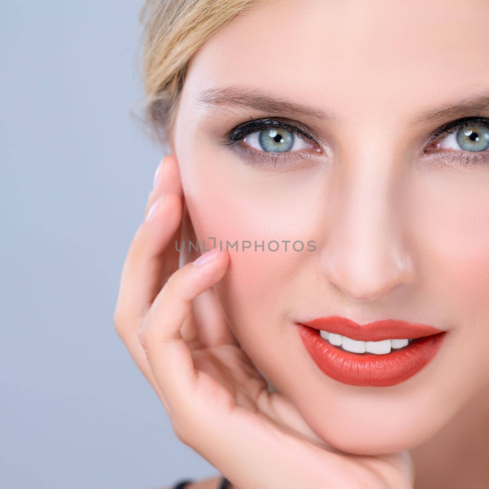 Closeup pretty beautiful woman with alluring perfect smooth and clean skin portrait in isolated background. Hand gesture with expressive facial expression for beauty model concept.